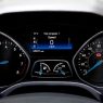 Close-up view of a Ford Focus dashboard showing the speedometer and various gauges.